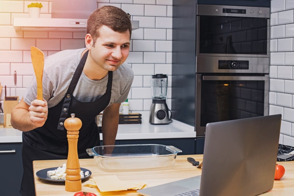 Man taking part in a virtual cooking class